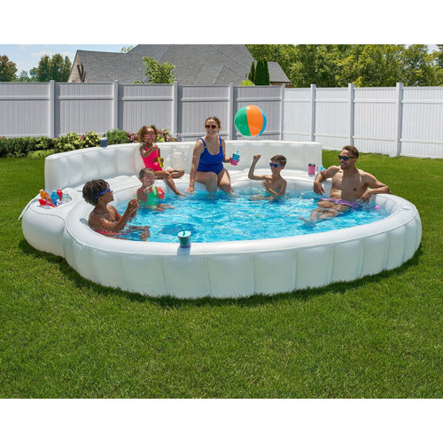 FLOAVI Oversized Inflatable Sofa Pool with family enjoying summer